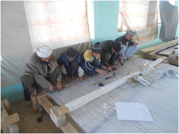Carpet Weaving Project beneficiaries during work male 3